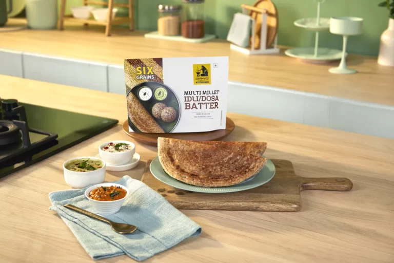 Give the Amma's Special Multi Millet Idli/Dosa Batter a gentle stir to bring it back to an even, pourable consistency. Heat a flat tawa or non-stick pan on medium-high flame. Once hot, sprinkle a few drops of water — it should sizzle and evaporate immediately, meaning the tawa is ready. Pour a ladleful of batter in the center and spread it outward in a thin, circular motion using the back of the ladle, working from the center outward. Drizzle a little oil or ghee around the edges and let it cook undisturbed on medium flame until the base turns golden brown and crisp, about 2–3 minutes. Since this is a multi-grain batter, let it cook a touch longer than a regular dosa for that signature crisp, nutty crunch — no need to flip. Fold the dosa in half or into a roll once the edges lift easily off the tawa. Serve immediately, hot, with coconut chutney, coriander chutney, and a bowl of sambar on the side.